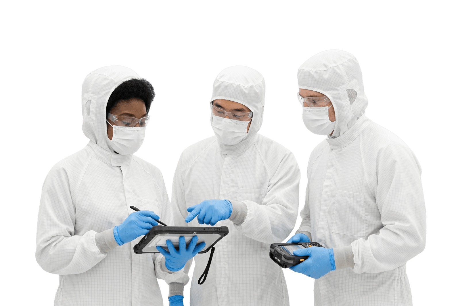 Three semiconductor engineers in cleanroom suits collaborating in a fabrication facility